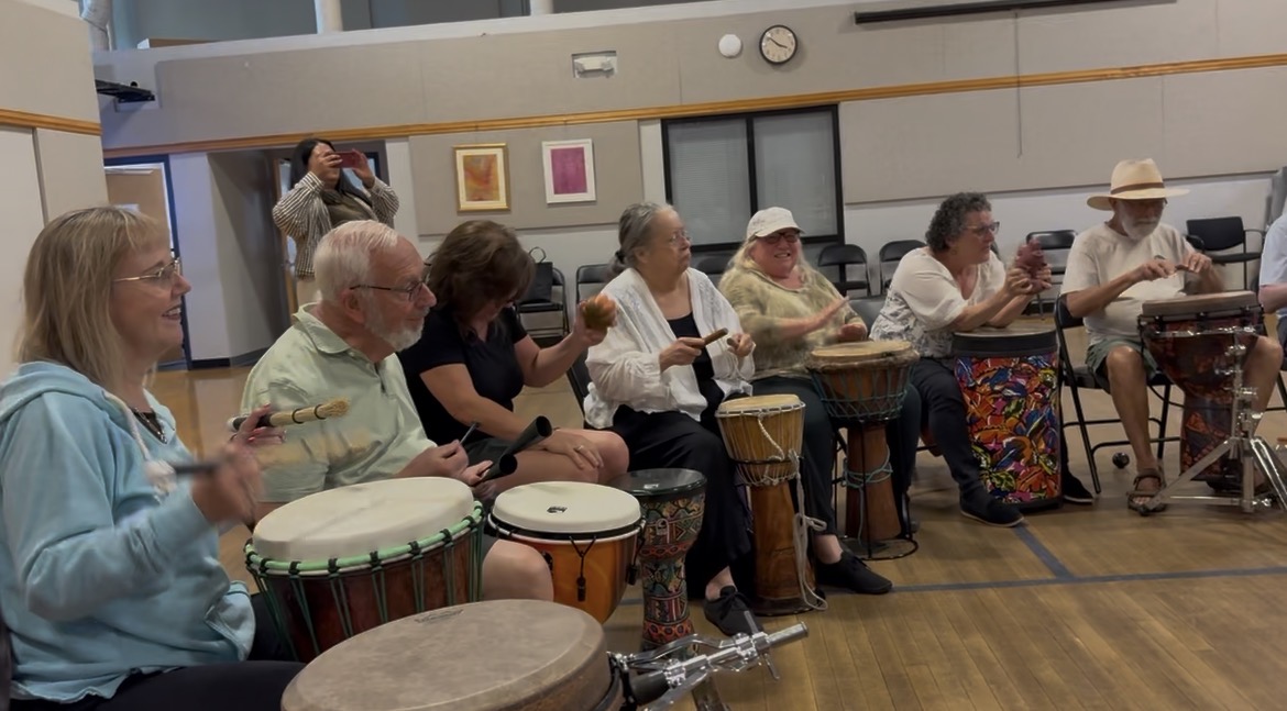 CMAP participants playing drums during Pulse Synergy's session